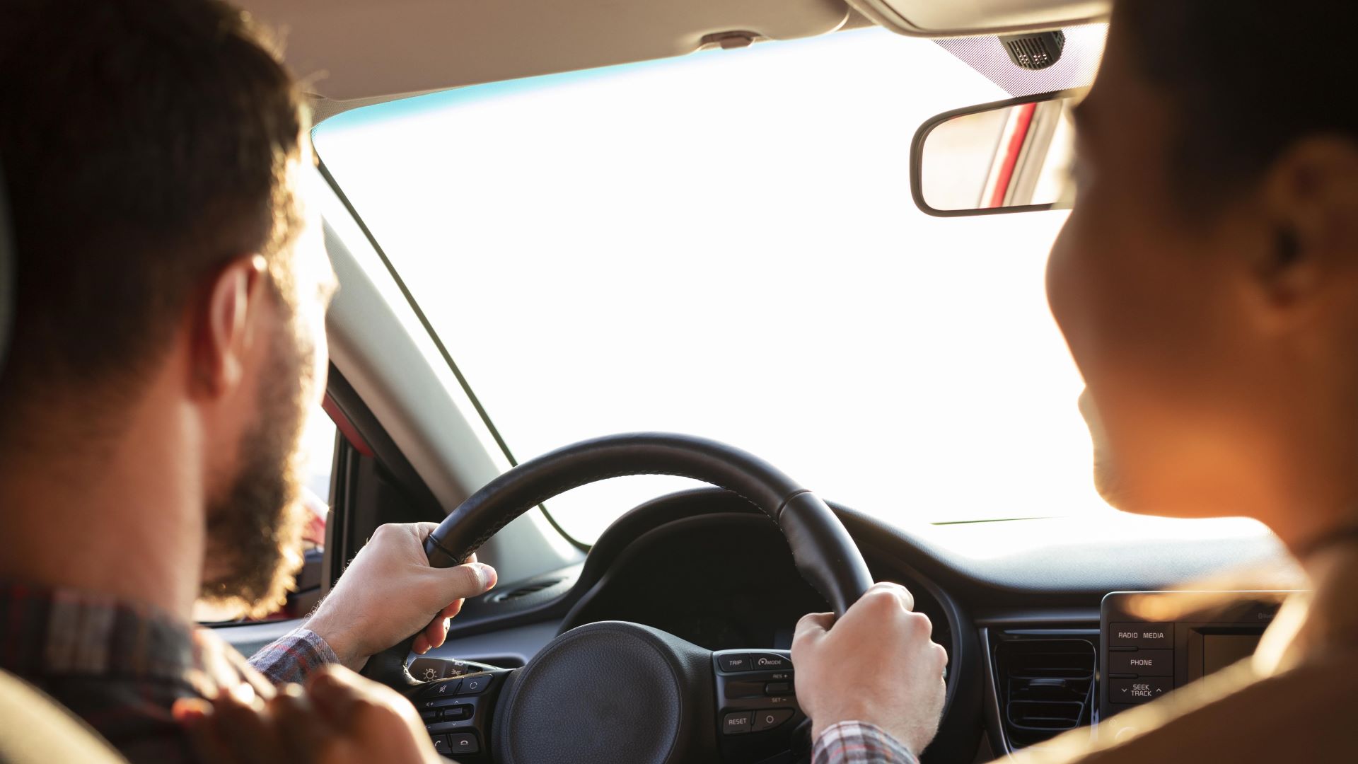 man driving his girlfriend