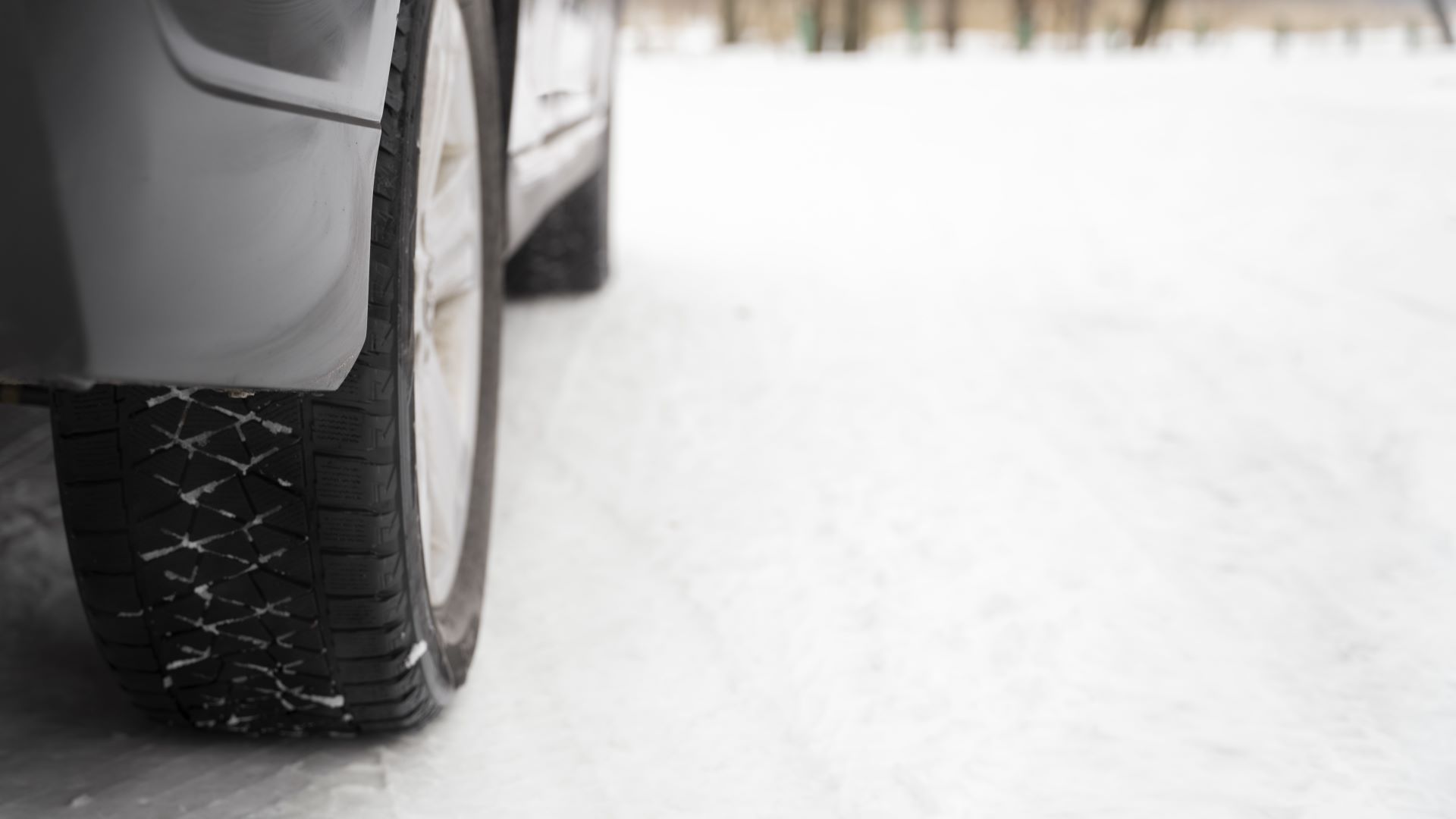 close up car tire winter roadtrip